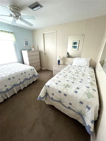 a room with stainless steel appliances kitchen island a table and chairs