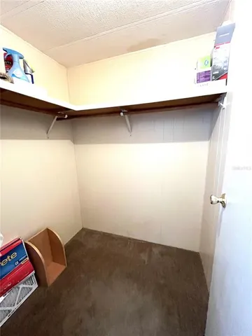 a view of a house with pool and a yard