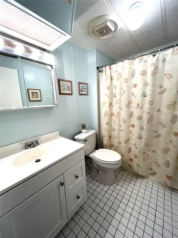 a view of a house with swimming pool and sitting area