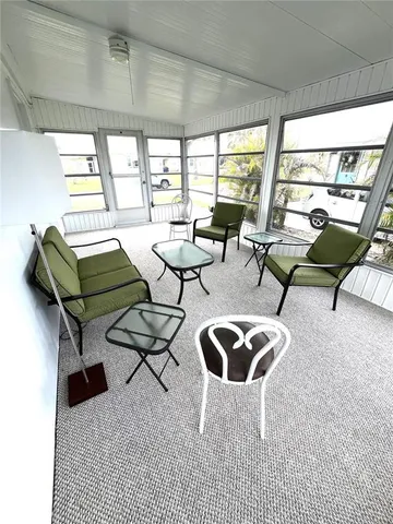 a view of a living room and entryway