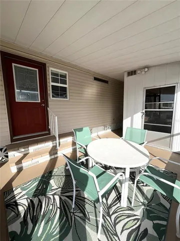 a room with lots of furniture and a book shelf