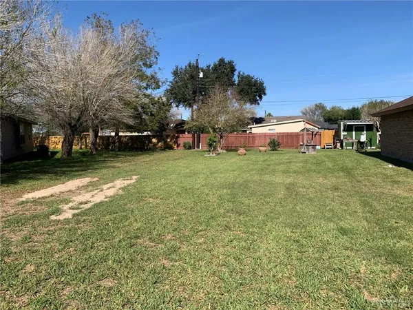 a view of a tree in front of a house