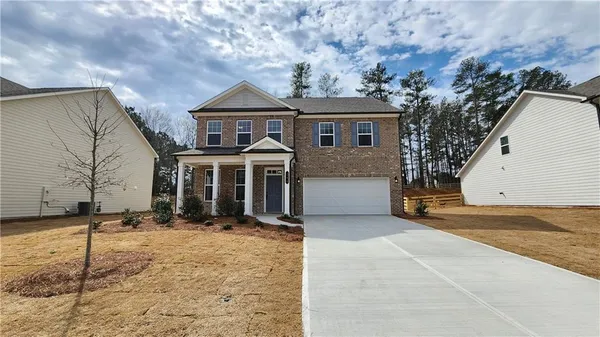 a view of a house with a yard