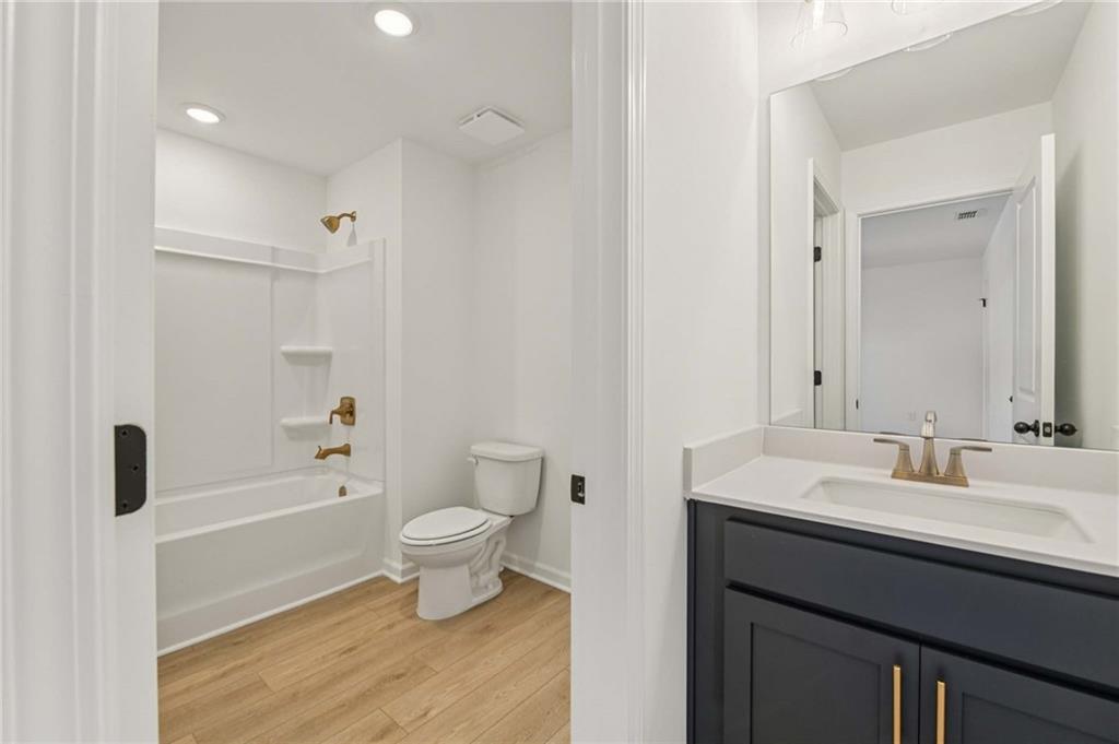 280 Silverleaf Trail Bethlehem, GA 30620 - Photo 25 of 40 a bathroom with a sink a toilet a shower and a mirror
