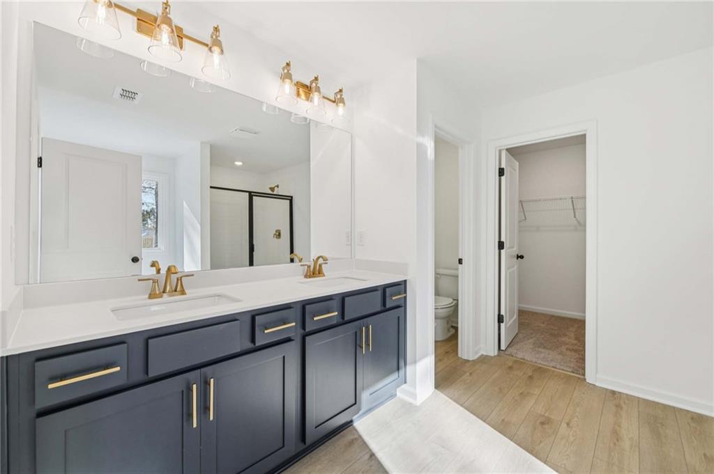 280 Silverleaf Trail Bethlehem, GA 30620 - Photo 35 of 40 a spacious bathroom with a double vanity sink mirror and double