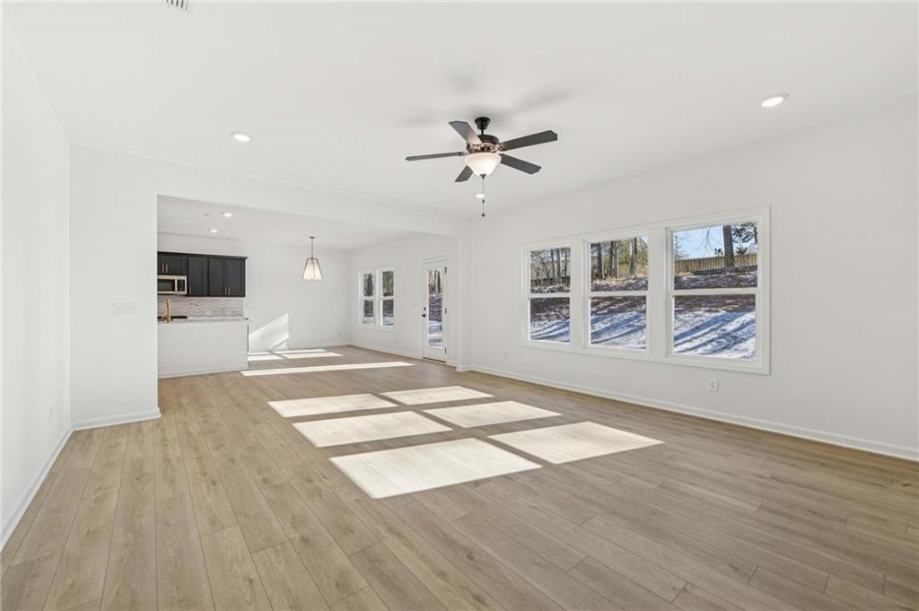 280 Silverleaf Trail Bethlehem, GA 30620 - Photo 8 of 40 a view of livingroom with hardwood floor and a ceiling fan