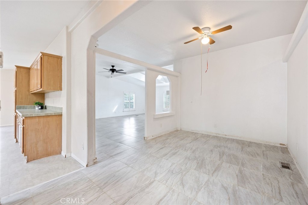 43870 Wilson Valley Road Hemet, CA 92544 - Photo 12 of 35 an empty room with wooden floor and cabinet