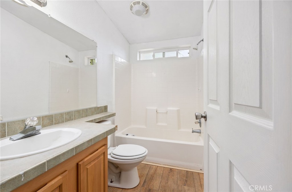 43870 Wilson Valley Road Hemet, CA 92544 - Photo 16 of 35 a bathroom with a granite countertop sink toilet and shower