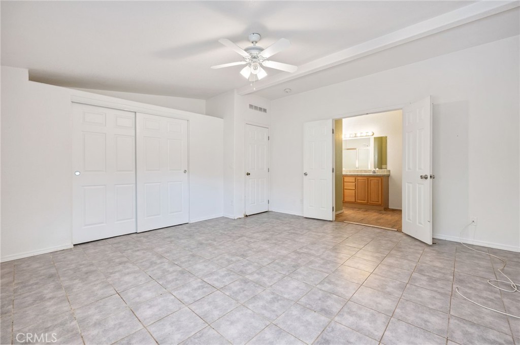 43870 Wilson Valley Road Hemet, CA 92544 - Photo 20 of 35 an empty room with fan and a ceiling fan