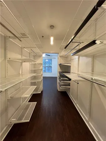 a view of an empty walk in closet