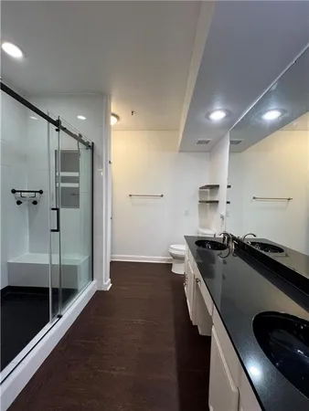 a kitchen with kitchen island a sink stove and refrigerator