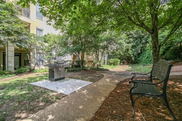 a view of a chairs and tables in the backyard of the house