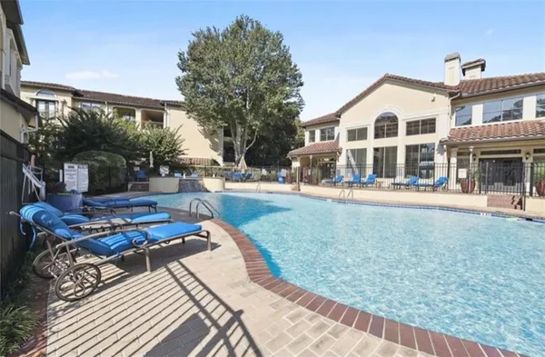 a view of a white house with a yard