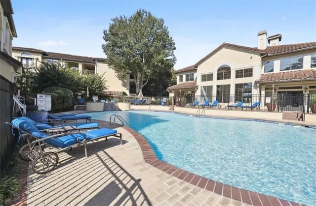 a view of hall way with furniture