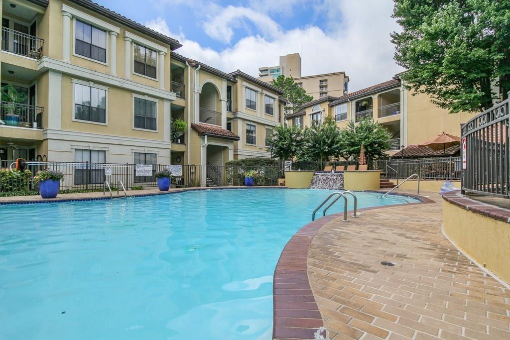 3777 Peachtree Road Northeast, Unit 1116 Brookhaven, GA 30319 - Photo 22 of 28 a view of a building with a yard