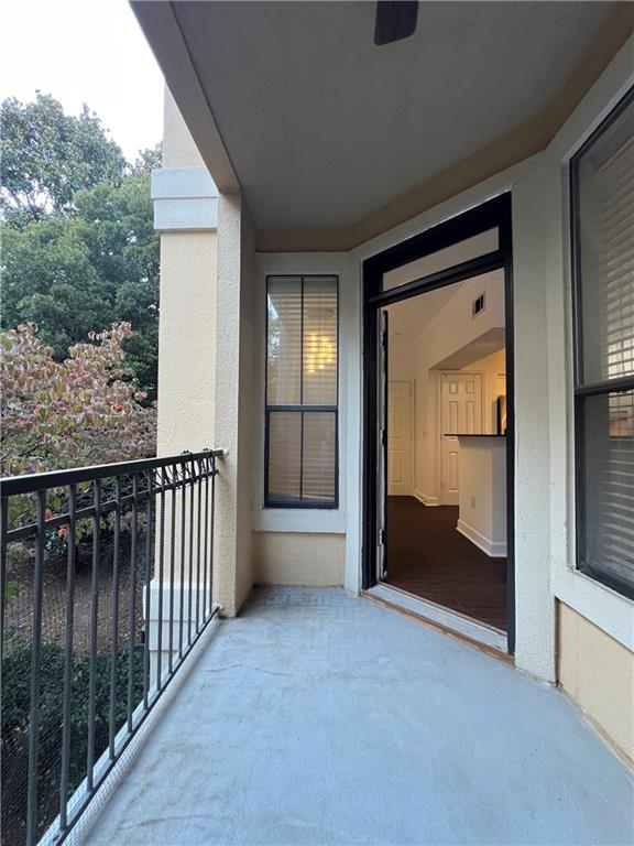 3777 Peachtree Road Northeast, Unit 1116 Brookhaven, GA 30319 - Photo 10 of 28 an empty room with wooden floor and windows