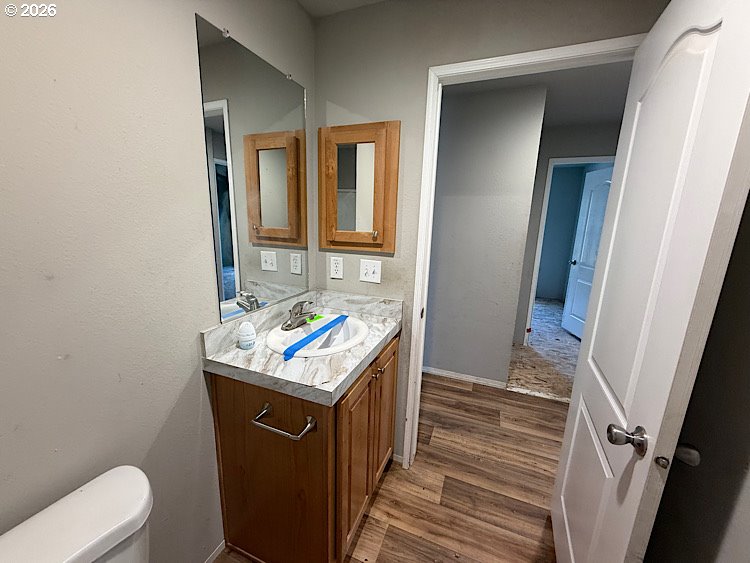 16125 Hawks Lair Road La Pine, OR 97739 - Photo 16 of 35 a bathroom with a sink toilet and mirror