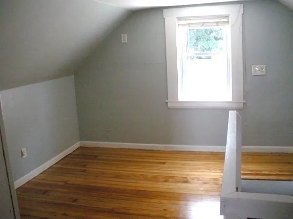 a view of a house with a small deck