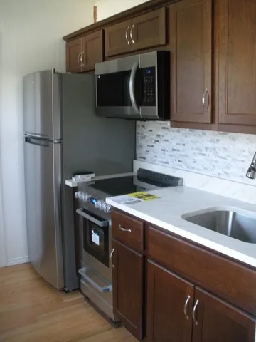 a kitchen with a stove and a microwave
