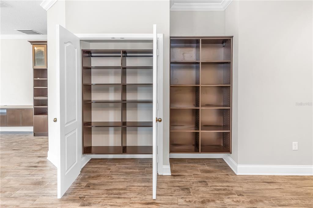 1270 Turnbridge Place Oviedo, FL 32765 - Photo 13 of 14 a view of an empty room with wooden shelves