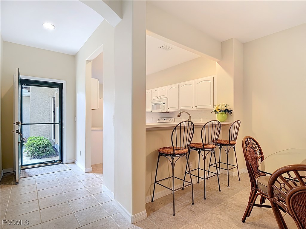 3600 Rue Alec Loop, Unit 4 North Fort Myers, FL 33917 - Photo 12 of 43 a view of a livingroom with furniture window and outside view