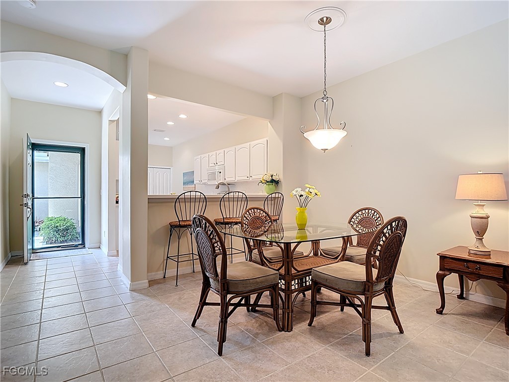 3600 Rue Alec Loop, Unit 4 North Fort Myers, FL 33917 - Photo 14 of 43 a view of a dining room with furniture and chandelier