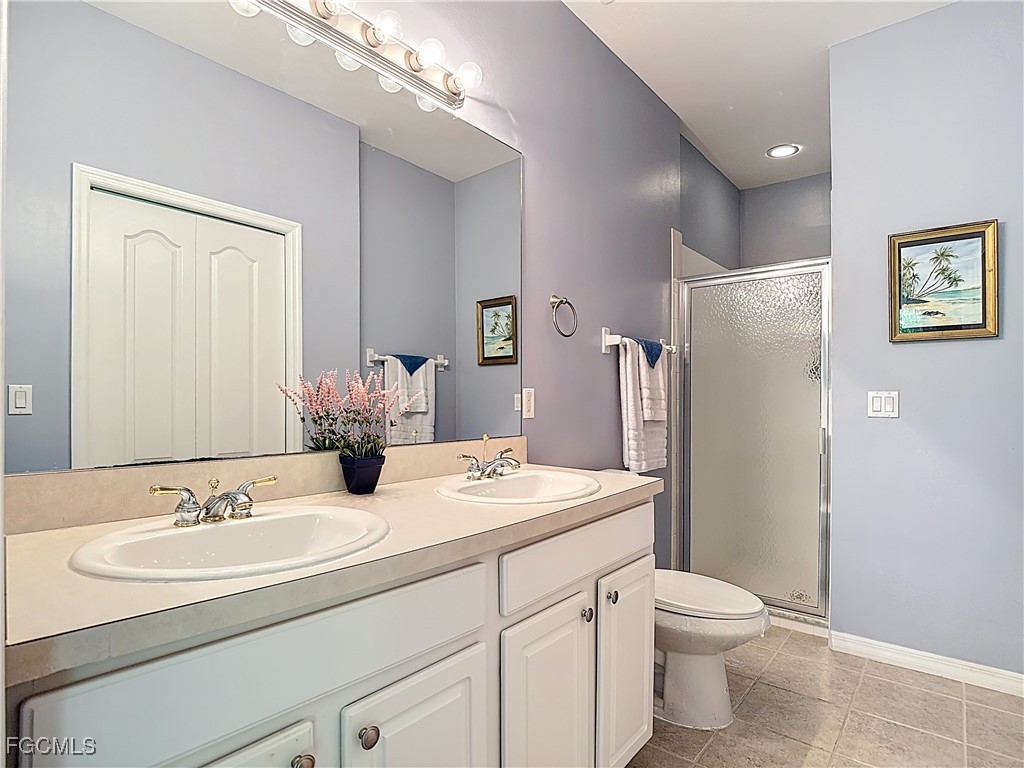 3600 Rue Alec Loop, Unit 4 North Fort Myers, FL 33917 - Photo 20 of 43 a bathroom with a sink toilet and shower