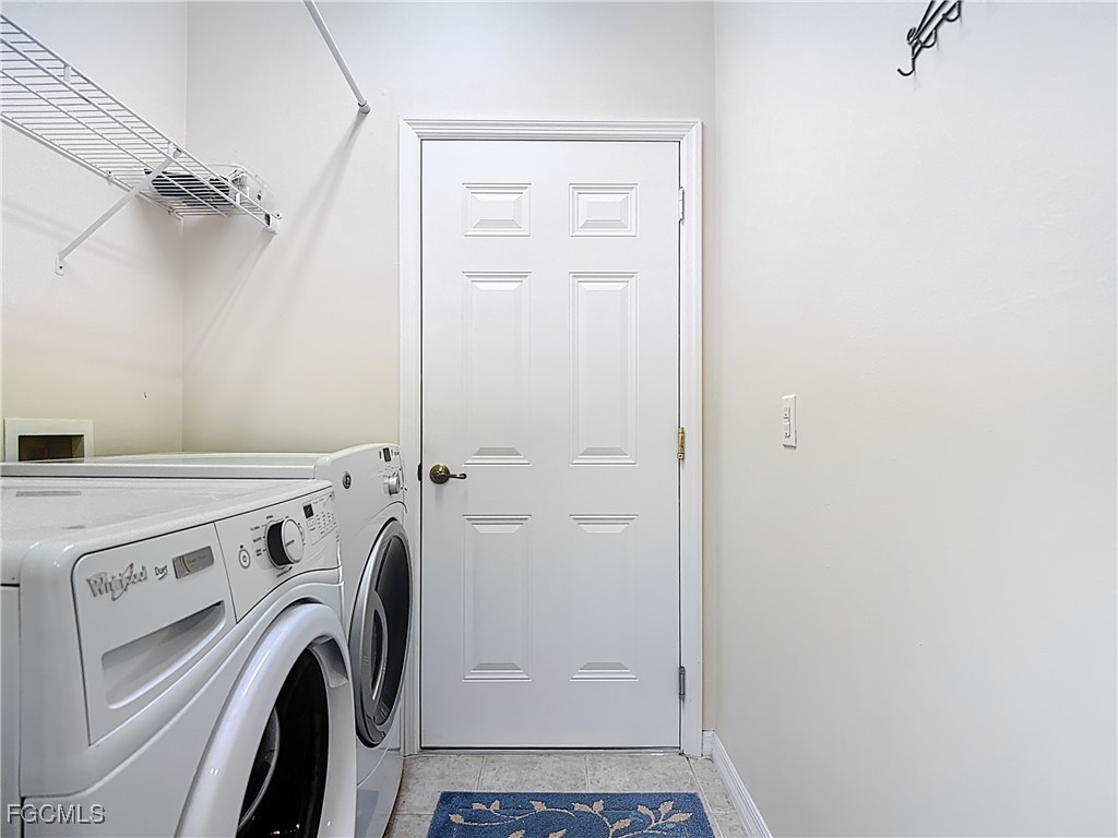 3600 Rue Alec Loop, Unit 4 North Fort Myers, FL 33917 - Photo 23 of 43 a view of a storage & utility room with dryer and washer