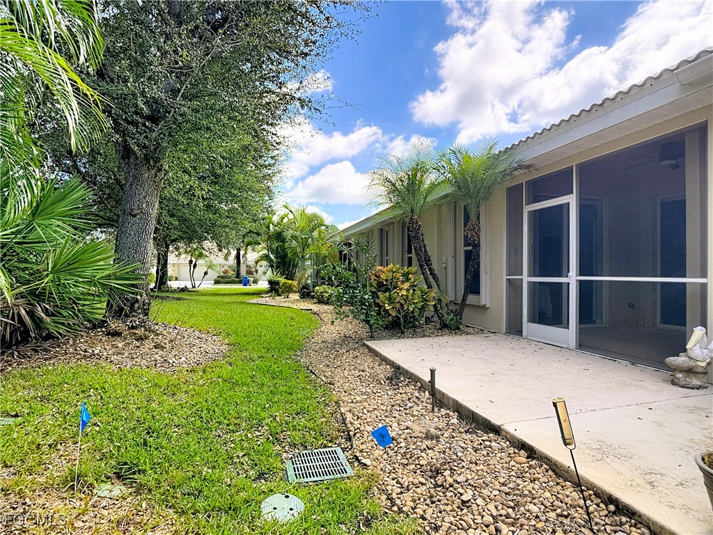 3600 Rue Alec Loop, Unit 4 North Fort Myers, FL 33917 - Photo 29 of 43 a view of a house with a yard