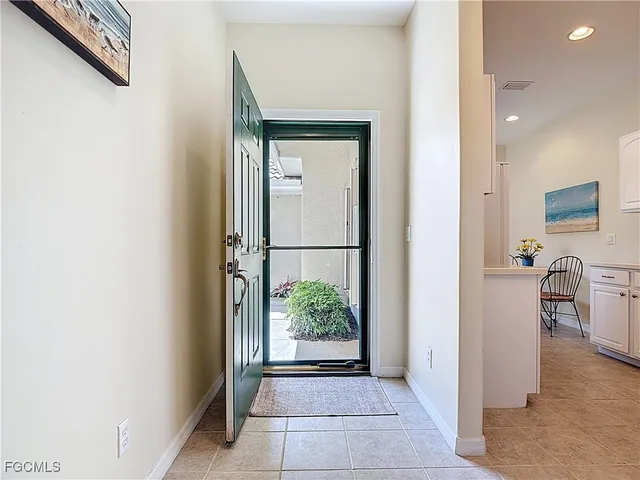 a kitchen with cabinets appliances and a sink