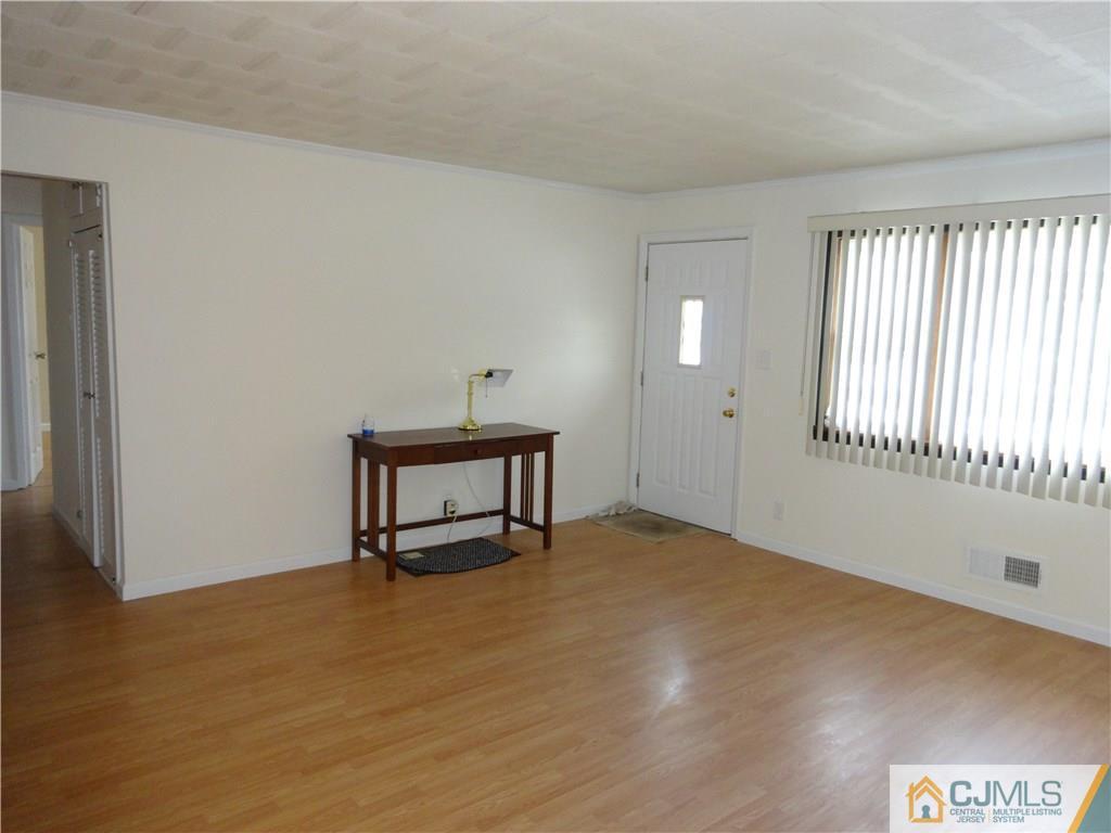 25 Sturgis Road Edison, NJ 08817 - Photo 3 of 8 a view of an empty room with a window