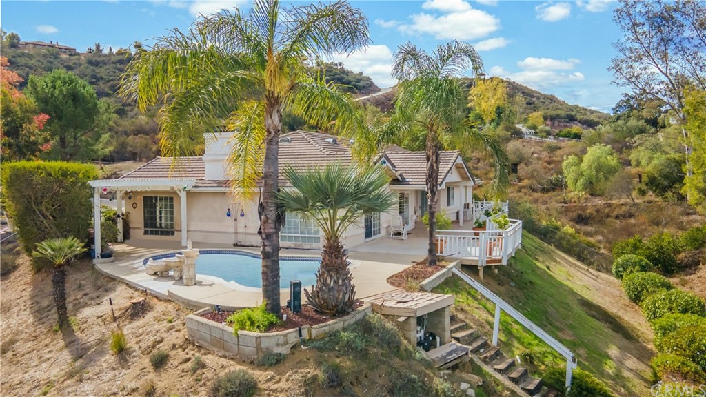 1818 Rocrest Road Alpine, CA 91901 - Photo 1 of 1 a swimming pool with outdoor seating and plants