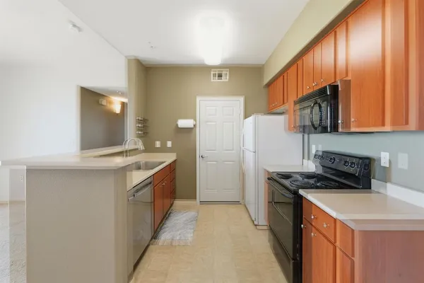 a kitchen with a stove microwave and refrigerator