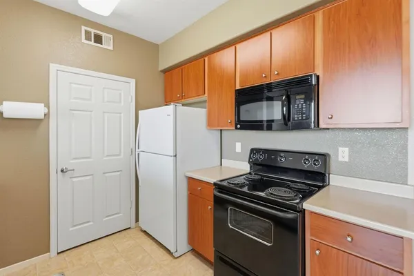 a view of a kitchen with a sink and a window