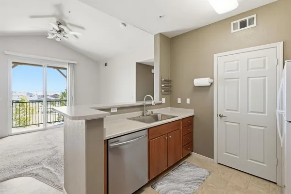 a kitchen that has a sink and a stove