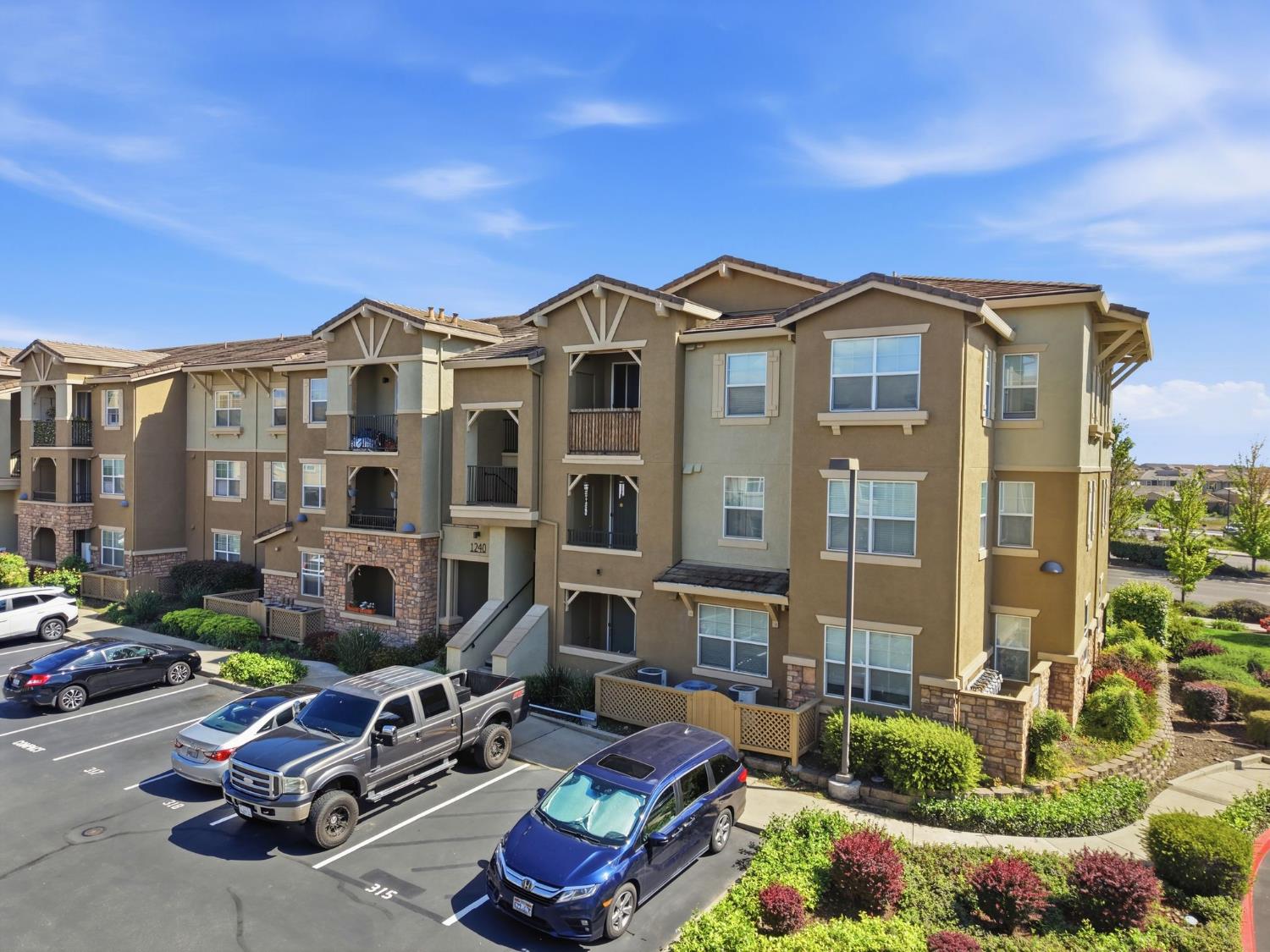 1240 Whitney Ranch Parkway, Unit PW338 Rocklin, CA 95765 - Photo 2 of 58 a front view of a house with yard and outdoor seating