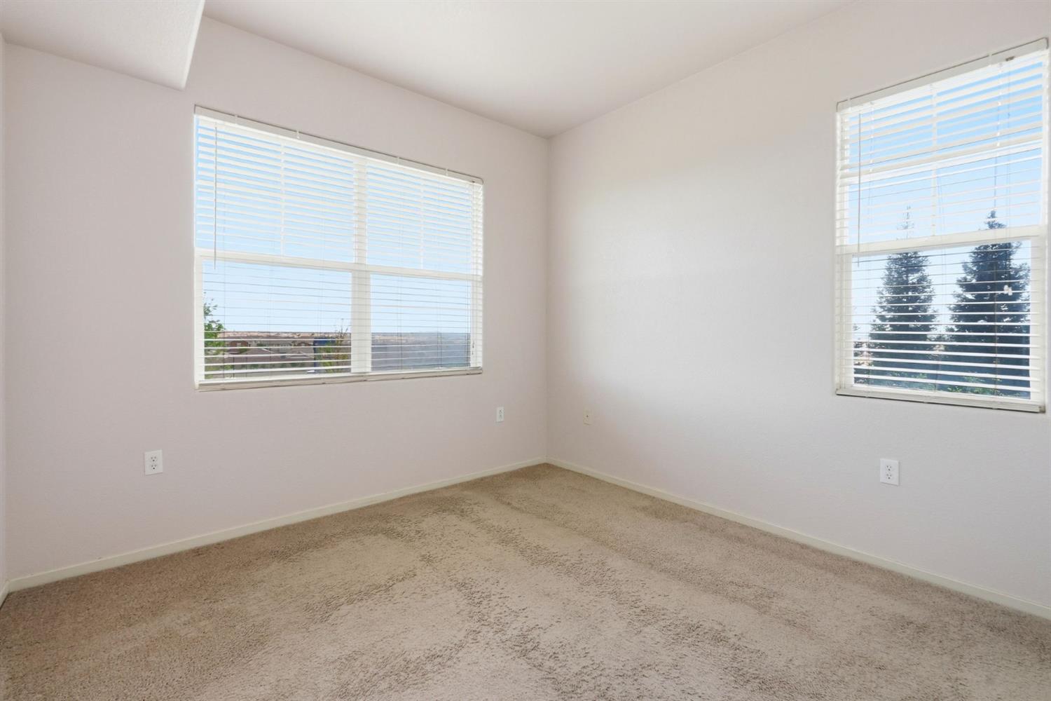 1240 Whitney Ranch Parkway, Unit PW338 Rocklin, CA 95765 - Photo 21 of 58 an empty room with a window