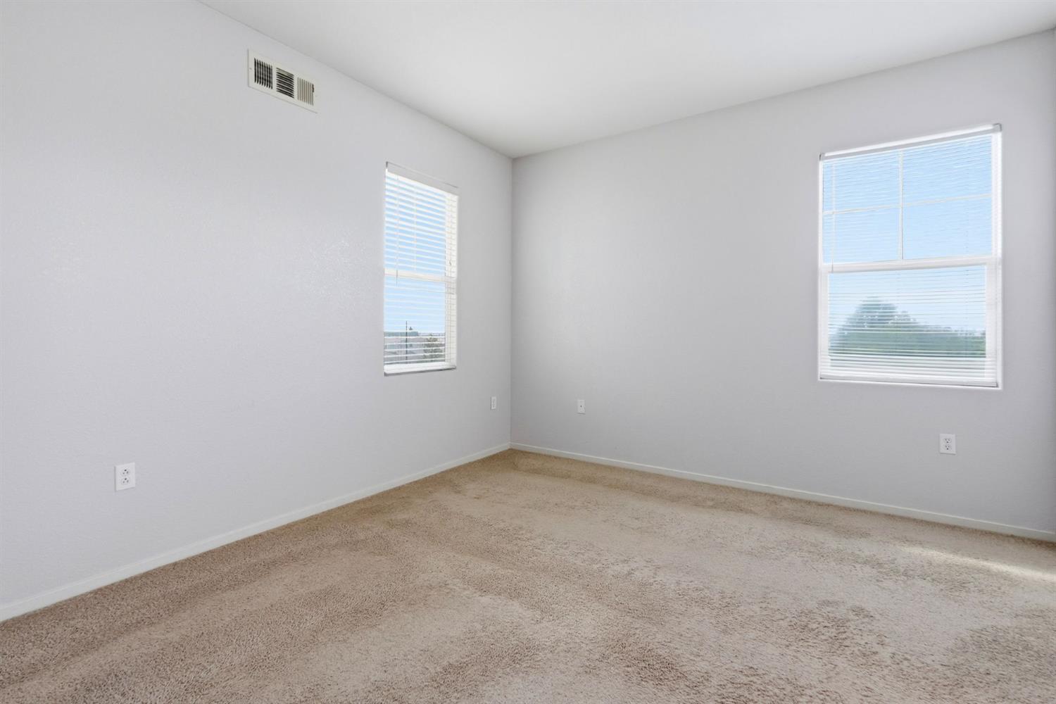 1240 Whitney Ranch Parkway, Unit PW338 Rocklin, CA 95765 - Photo 23 of 58 an empty room with windows