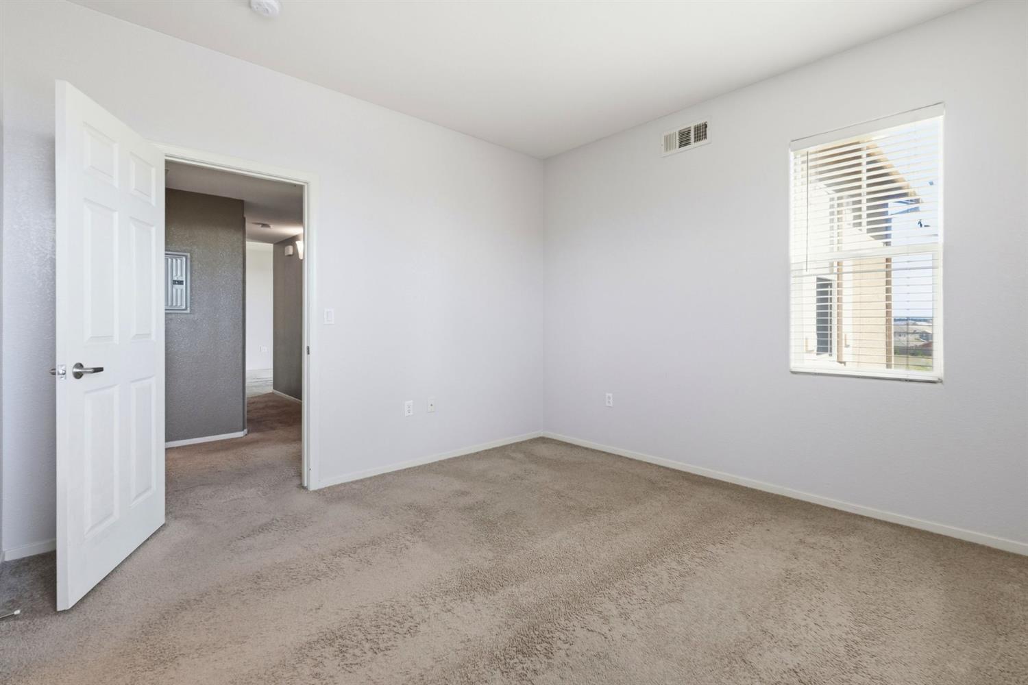 1240 Whitney Ranch Parkway, Unit PW338 Rocklin, CA 95765 - Photo 26 of 58 an empty room with windows