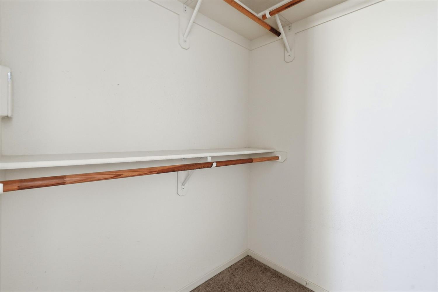 1240 Whitney Ranch Parkway, Unit PW338 Rocklin, CA 95765 - Photo 29 of 58 a view of a room with racks on the wall