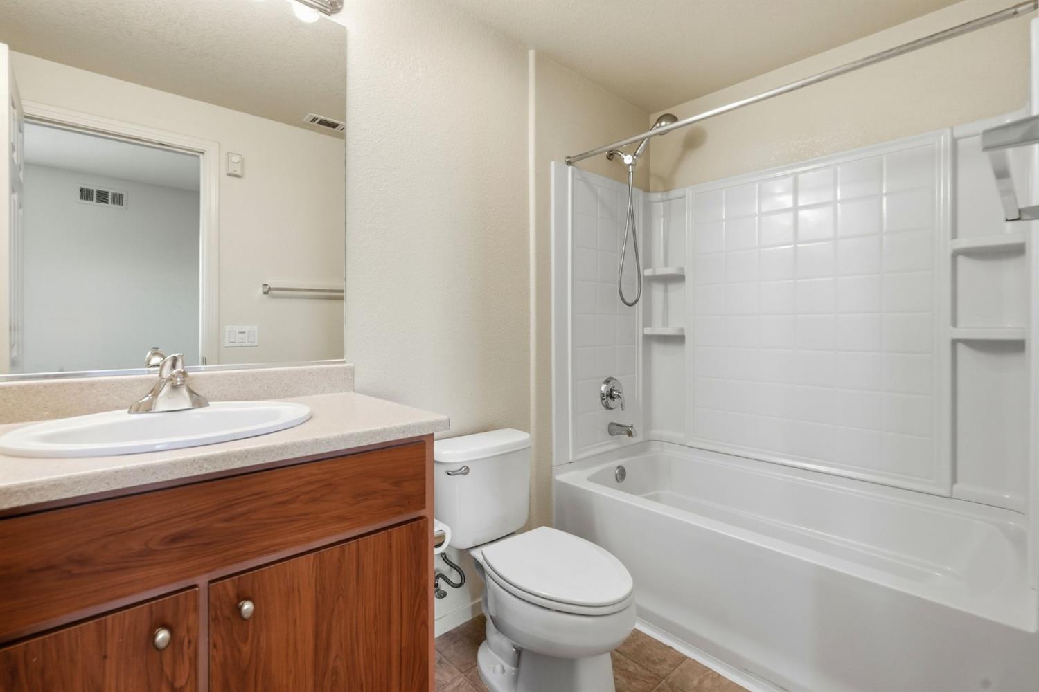 1240 Whitney Ranch Parkway, Unit PW338 Rocklin, CA 95765 - Photo 31 of 58 a bathroom with a sink toilet vanity and shower