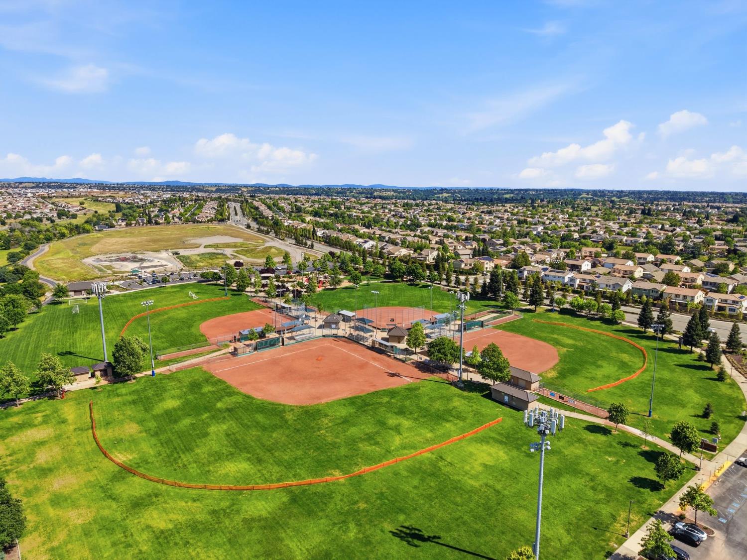 1240 Whitney Ranch Parkway, Unit PW338 Rocklin, CA 95765 - Photo 44 of 58 an aerial view of residential houses with outdoor space and trees