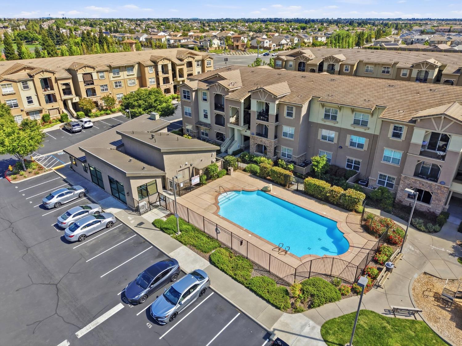 1240 Whitney Ranch Parkway, Unit PW338 Rocklin, CA 95765 - Photo 46 of 58 an aerial view of residential houses with outdoor space and swimming pool