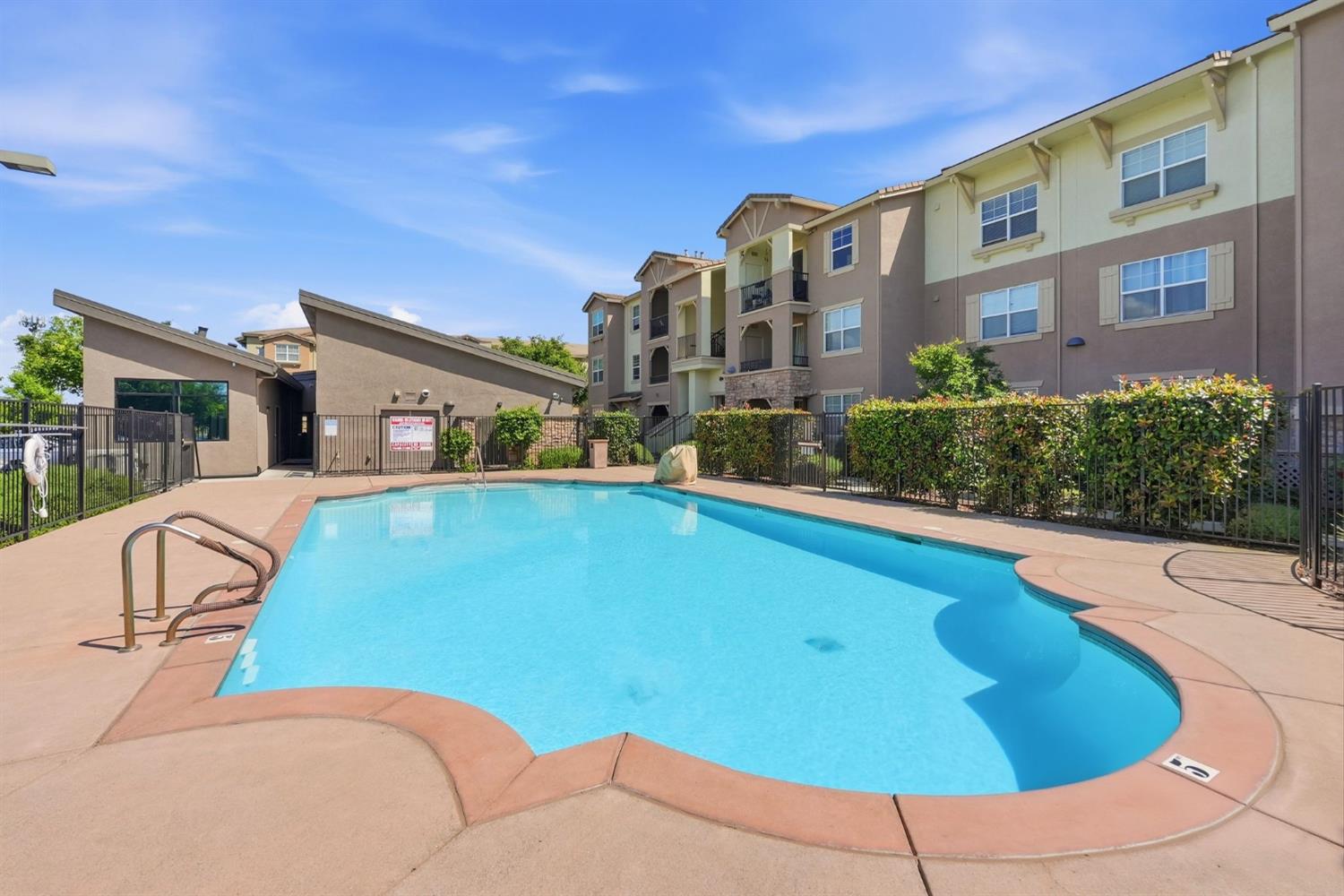 1240 Whitney Ranch Parkway, Unit PW338 Rocklin, CA 95765 - Photo 56 of 58 a view of a swimming pool with a patio