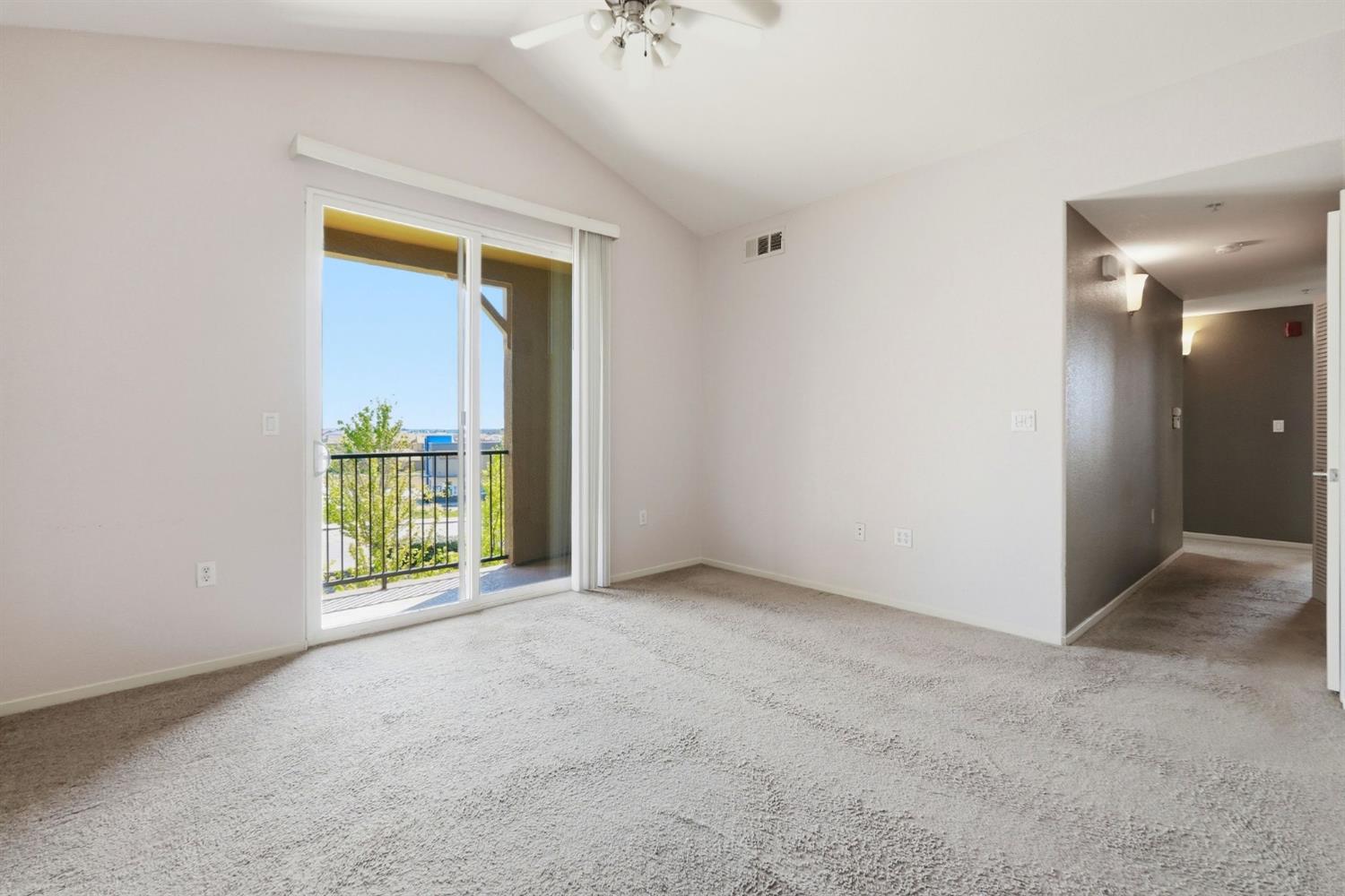 1240 Whitney Ranch Parkway, Unit PW338 Rocklin, CA 95765 - Photo 8 of 58 an empty room with a window and an entryway