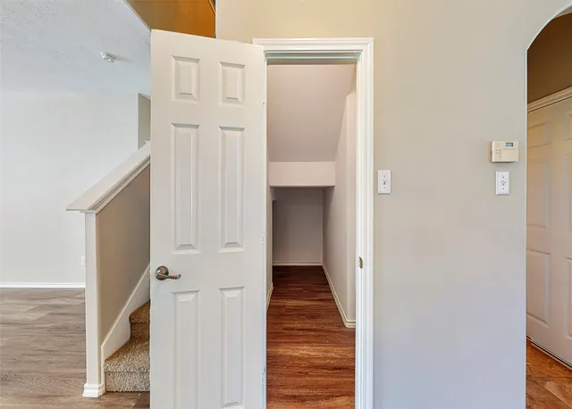 a view of a livingroom with a ceiling fan window and a fireplace