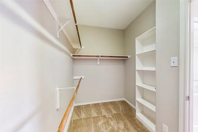 a bathroom with a tub shower and sink