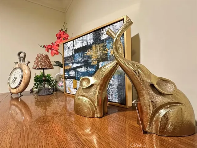 a view of living room with furniture and a mirror