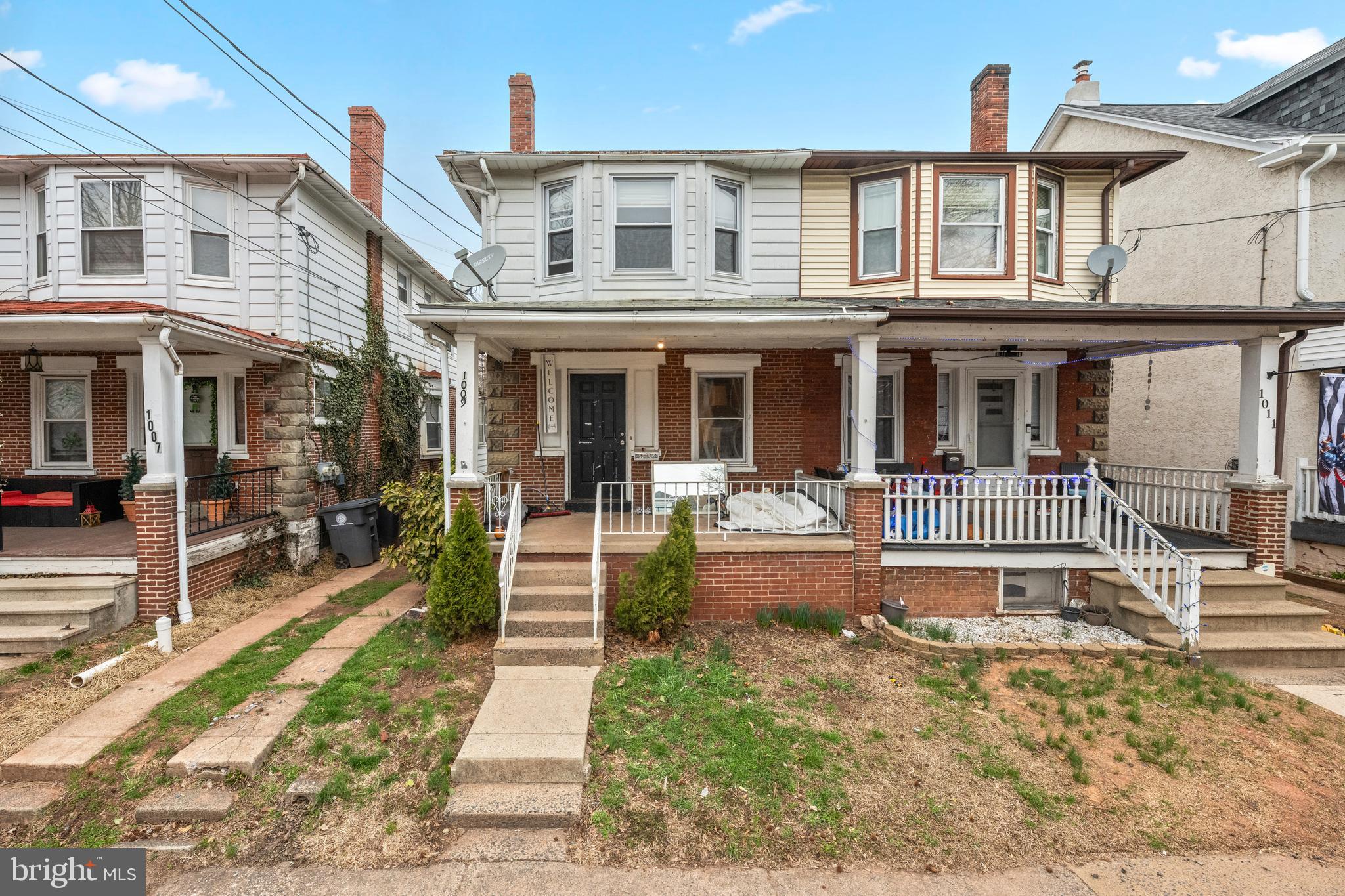 1009 Queen Street Pottstown, PA 19464 - Photo 1 of 17 a view of a building with a yard