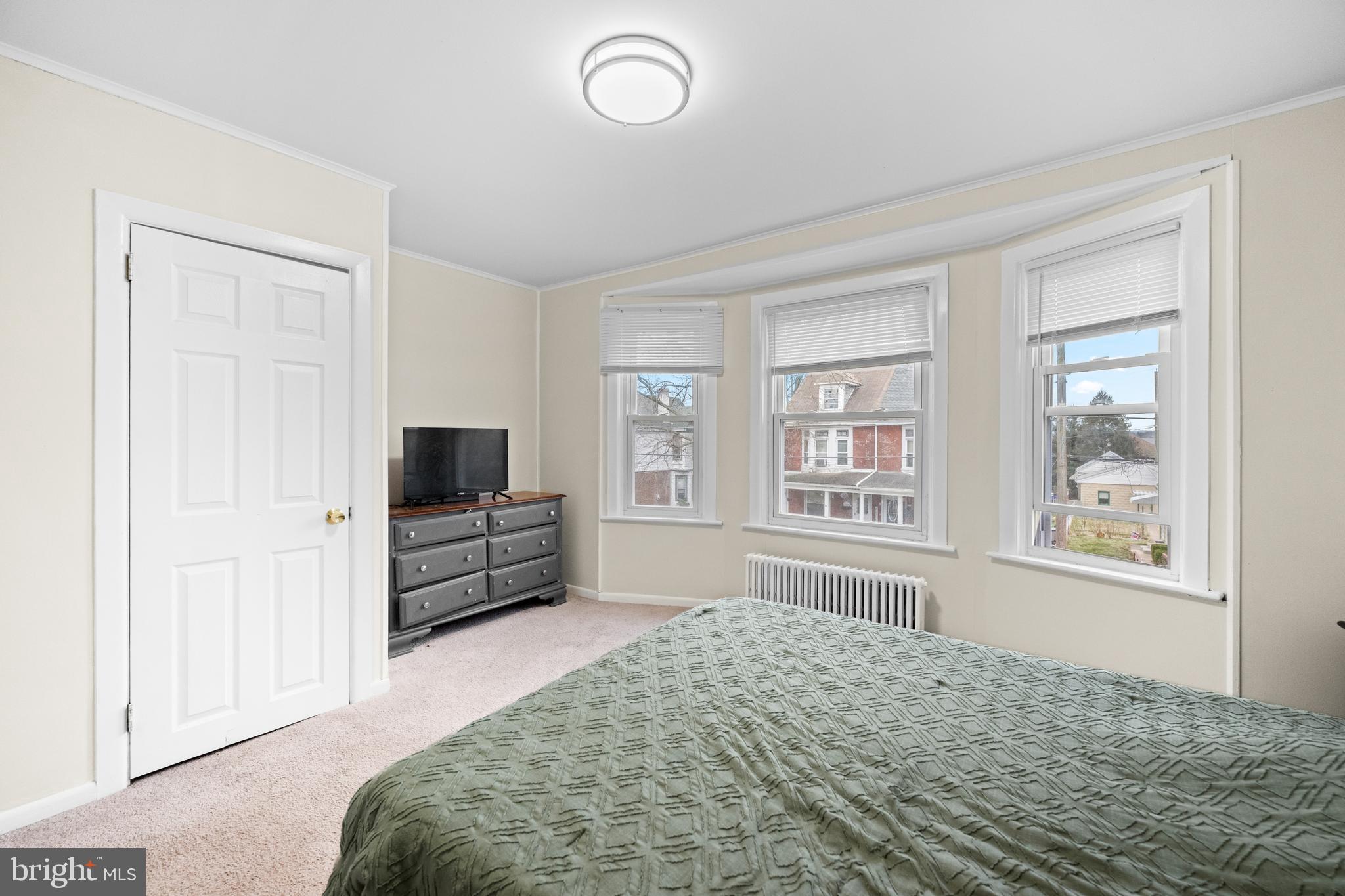 1009 Queen Street Pottstown, PA 19464 - Photo 13 of 17 a bedroom with furniture and flat screen tv